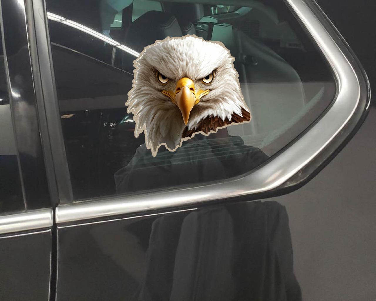 Here are a few options for alt text, keeping under 100 characters:
* **Two dogs & eagle sticker peek from truck bed.**
* **D