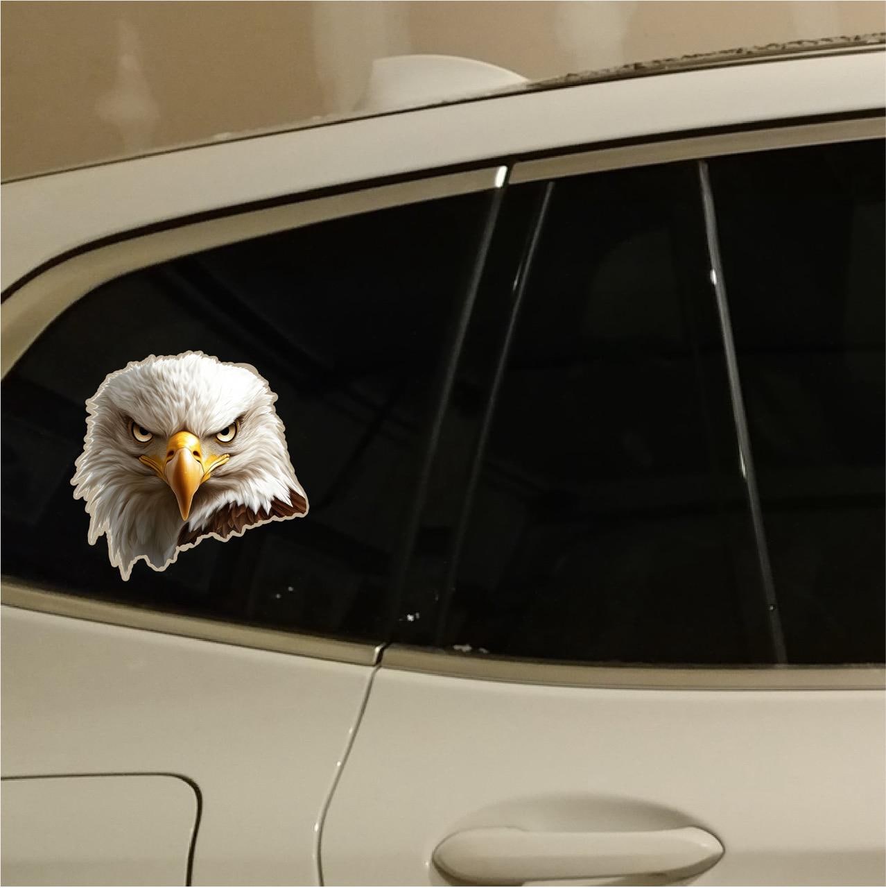 Here are a few options for alt text, keeping under 100 characters:
* **Two dogs & eagle sticker peek from truck bed.**
* **D