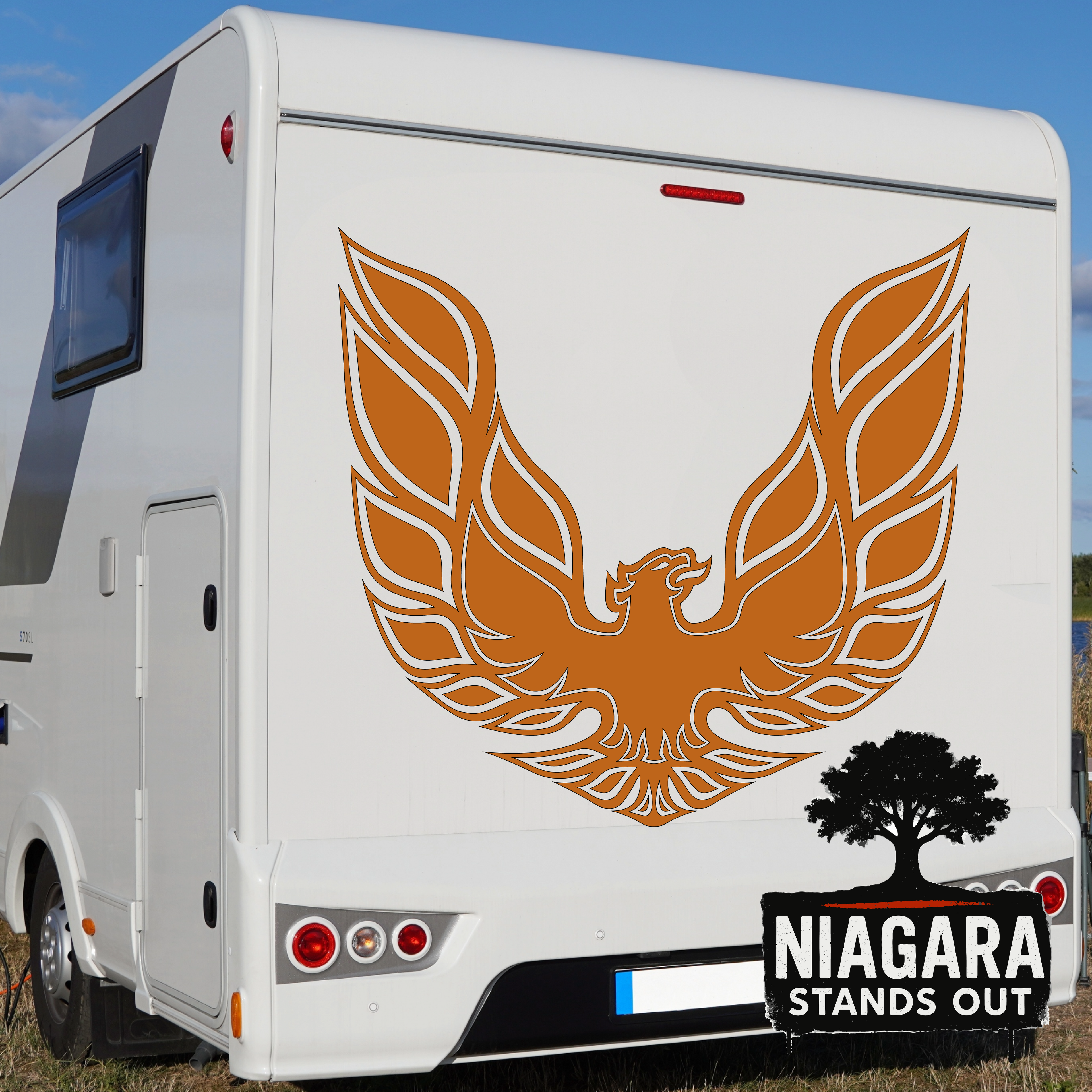 Orange eagle vinyl decal in flight above black tree silhouette with 'Niagara Stands Out' text for RV or car exterior