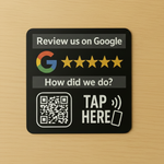 A 3-inch round rigid acrylic counter plaque and a 6-inch round vinyl window decal, both featuring NFC technology and QR codes, designed for businesses to encourage Google reviews, displayed on a clean surface with a professional look, emphasizing customer