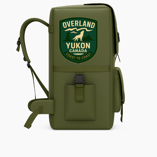 Olive green decal featuring a wolf and text 'Overland Yukon Canada Coast to Coast', ideal for outdoor gear and travel accessories.